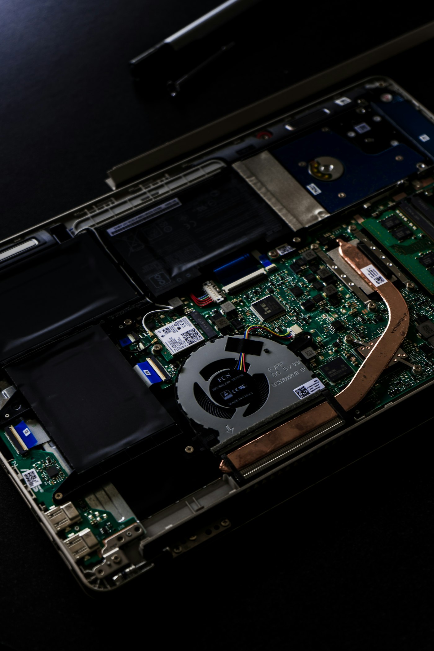 Open laptop logic board on the Wilko Tech bench